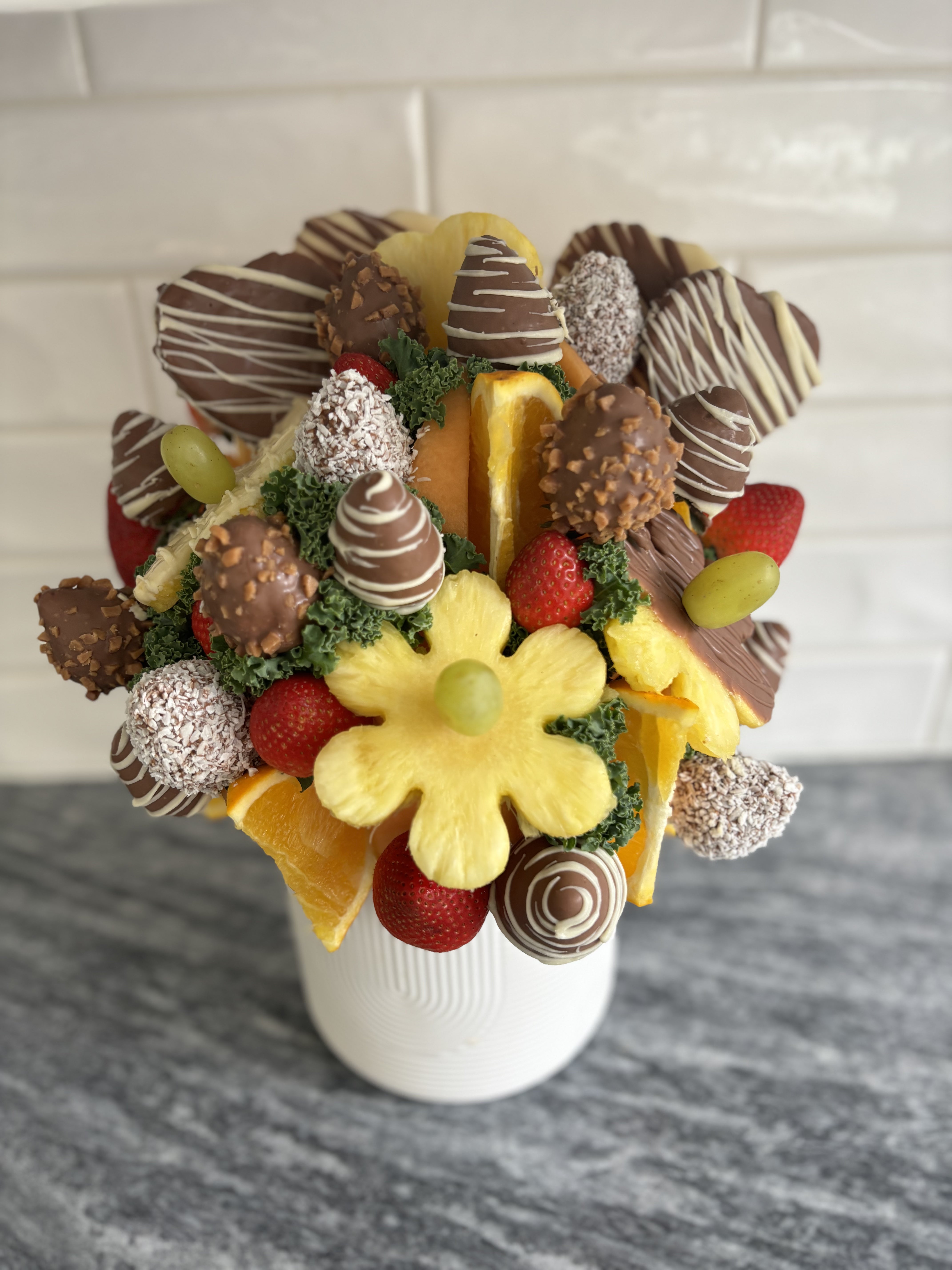 Sympathy bouquet Fruit over Flowers